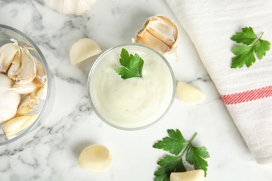 Photo of Flat lay composition with garlic sauce on marble background