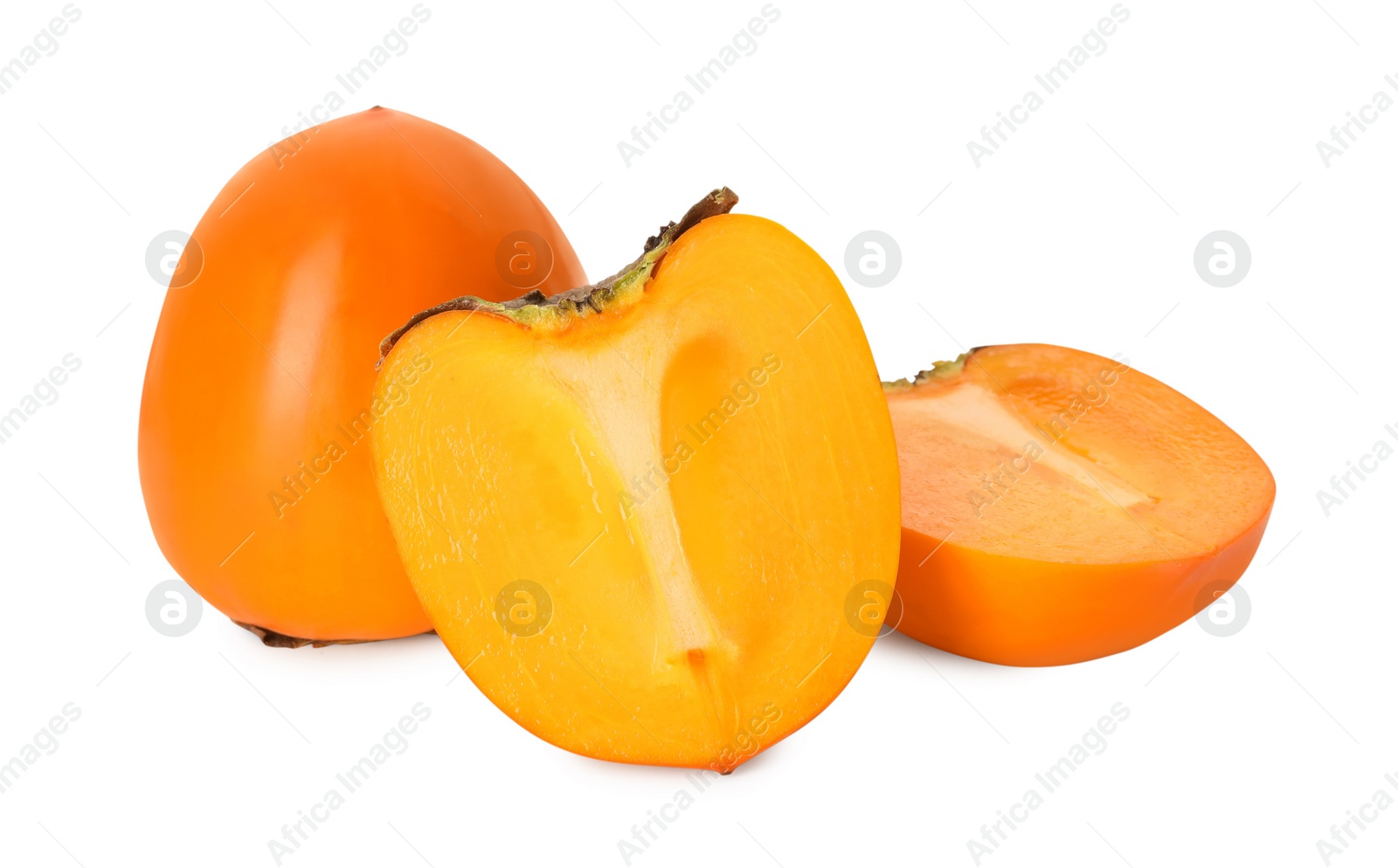 Photo of Whole and cut delicious ripe juicy persimmons on white background