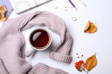 Photo of Composition with cup of hot drink on white background, top view. Cozy autumn atmosphere