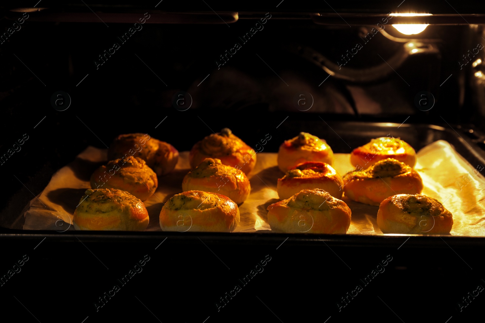 Photo of Baking puff pastry with tasty filling in oven