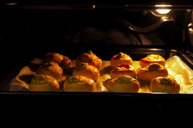 Baking puff pastry with tasty filling in oven