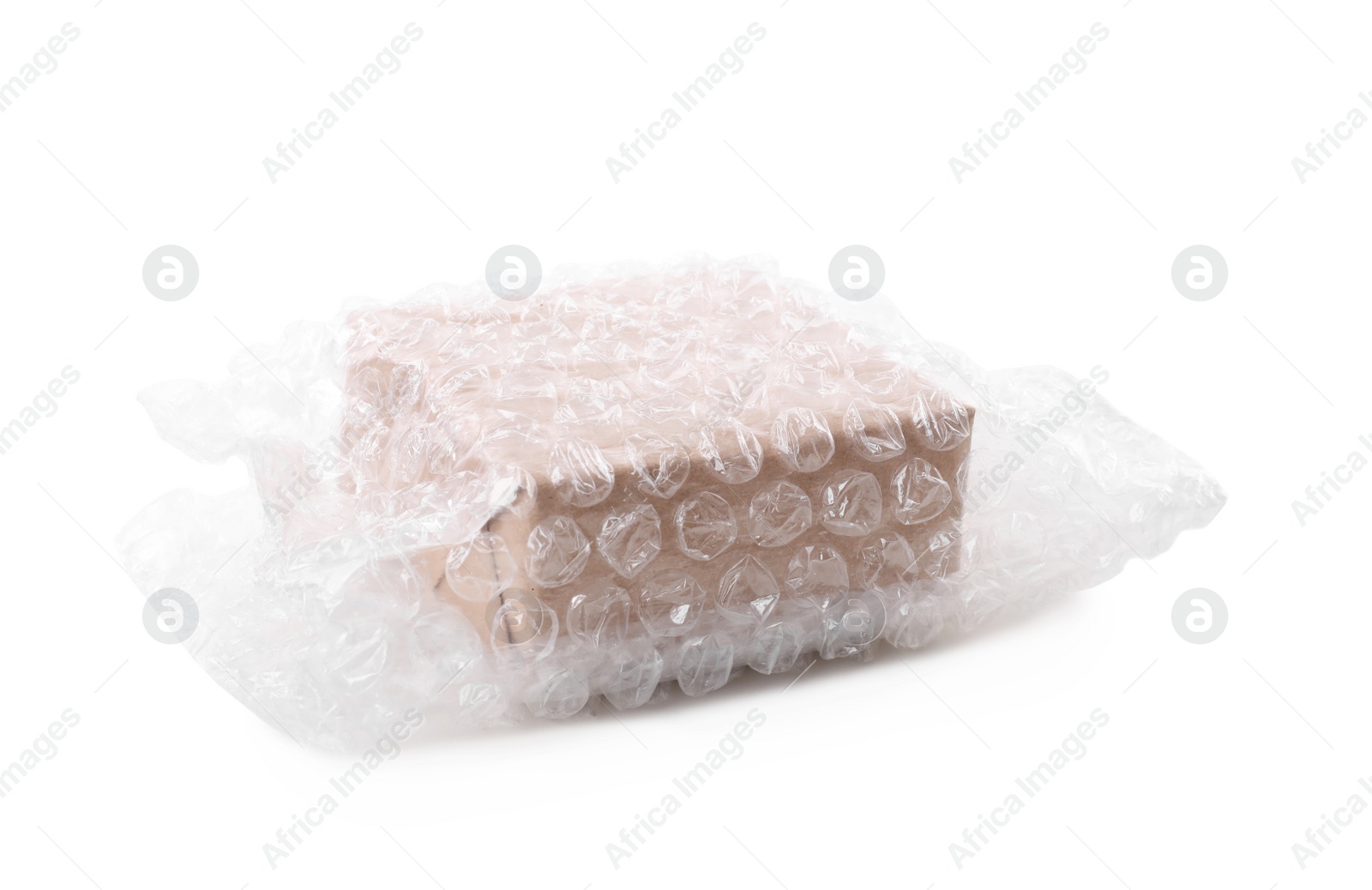 Photo of Cardboard box packed in bubble wrap isolated on white