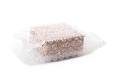 Cardboard box packed in bubble wrap isolated on white