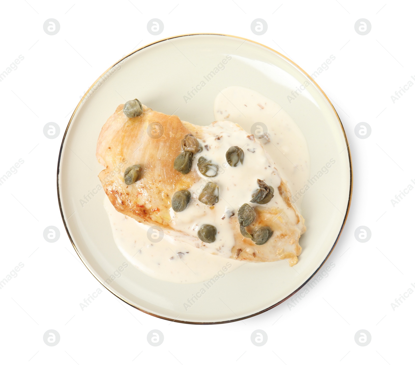 Photo of Delicious chicken fillet with capers and sauce isolated on white, top view