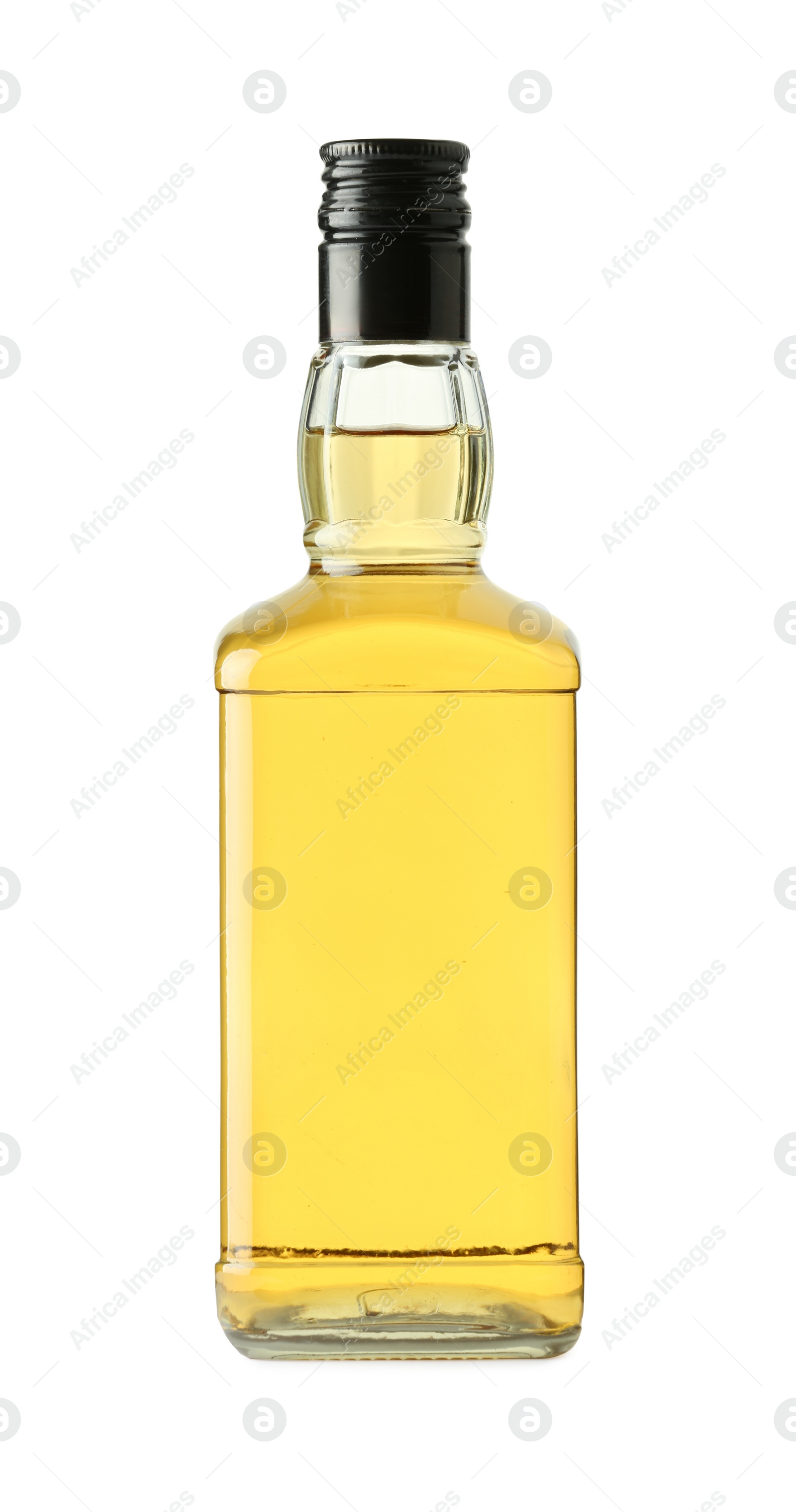 Photo of Whiskey in glass bottle isolated on white