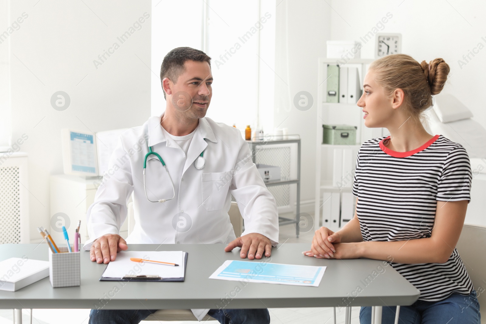 Photo of Patient having appointment with doctor in hospital