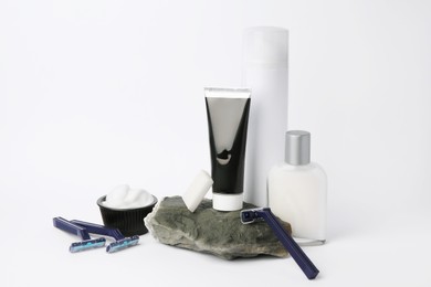 Different men's shaving accessories on light background