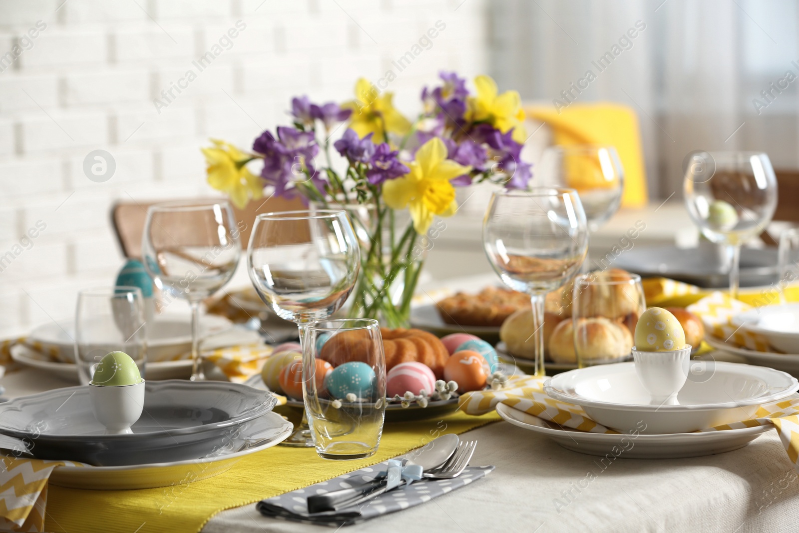 Photo of Festive Easter table setting with traditional meal at home