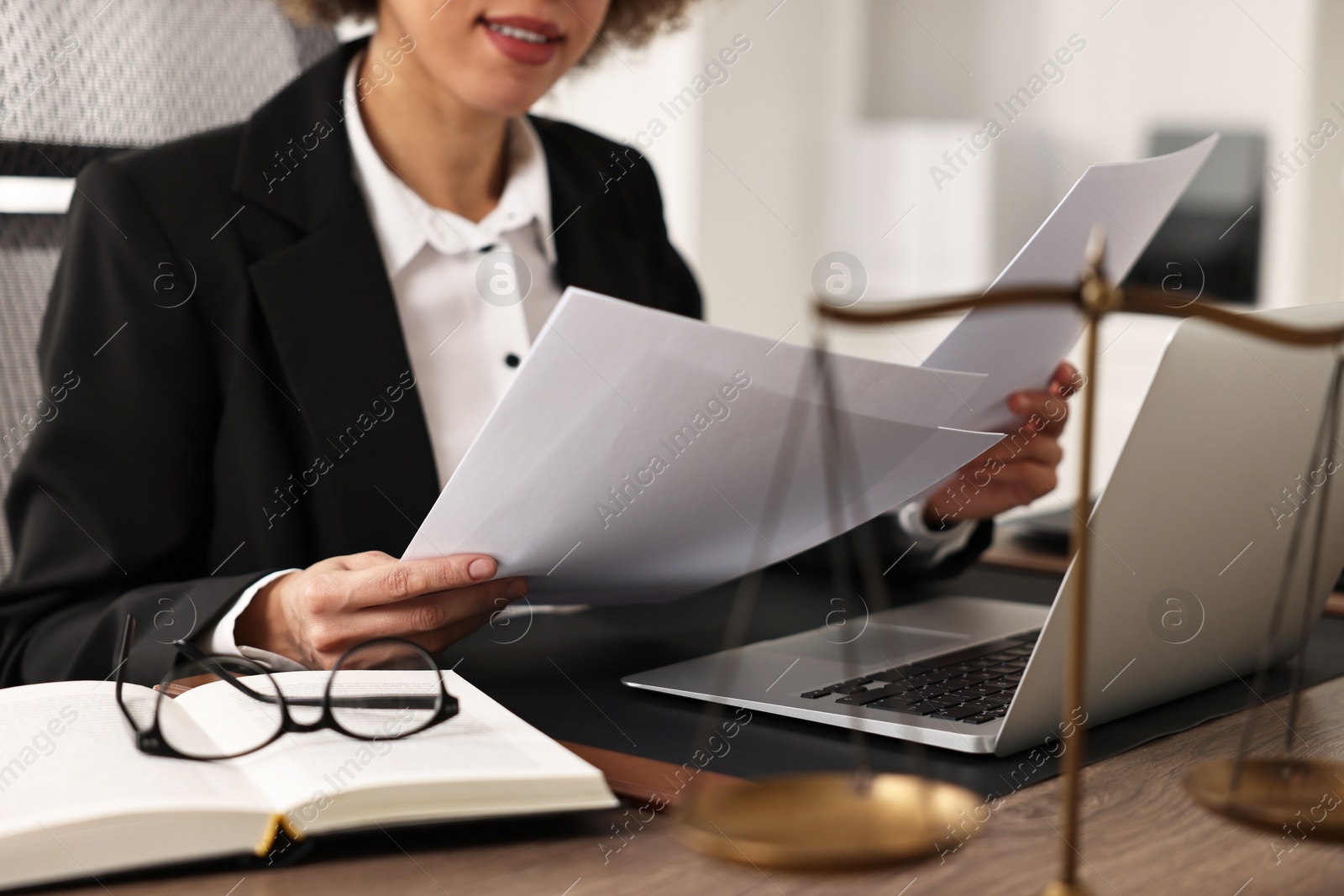 Photo of Notary working with documents at workplace in office, closeup