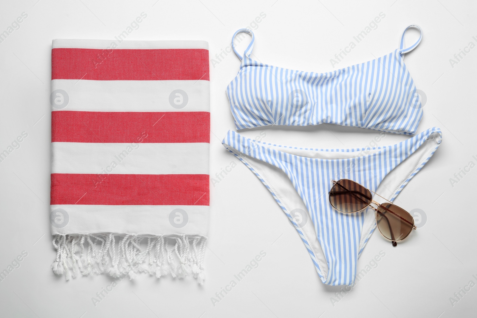 Photo of Flat lay composition with different beach objects on white background