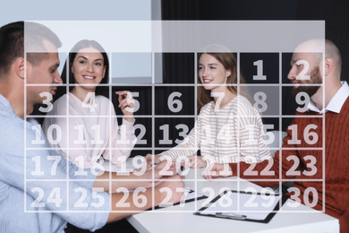 Image of Calendar and people having business meeting in conference room