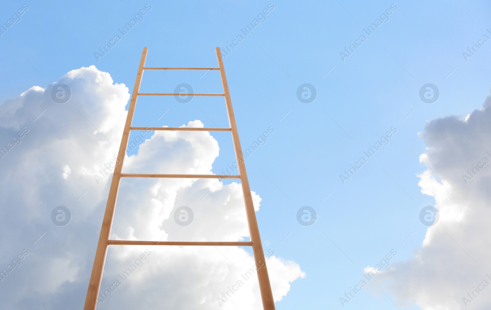 Image of Wooden ladder against blue sky with clouds, low angle view