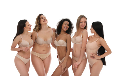 Photo of Group of women with different body types in underwear on white background