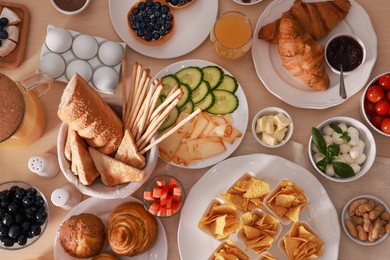 Photo of Dishes with different food on table, flat lay. Luxury brunch