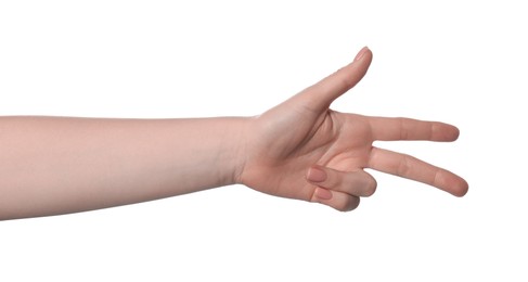 Playing rock, paper and scissors. Woman making scissors with her fingers on white background, closeup