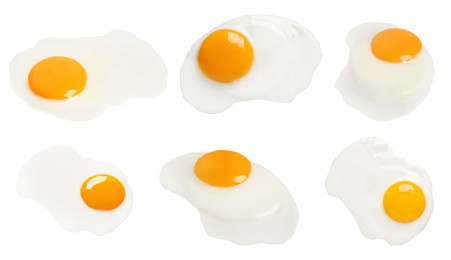 Set with tasty fried eggs on white background