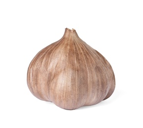 Photo of Unpeeled bulb of black garlic on white background