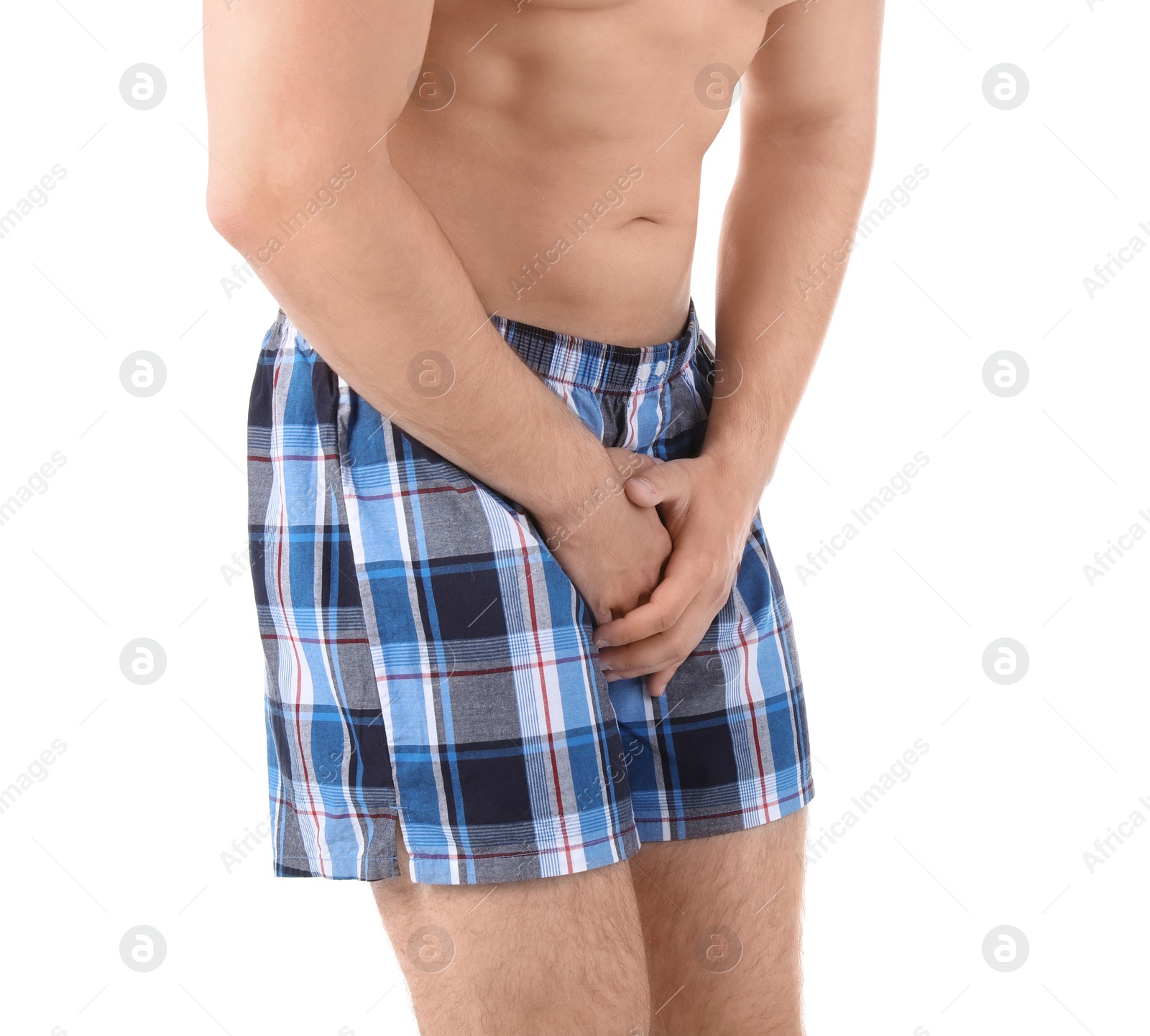 Photo of Young man with urological problems suffering from pain on white background