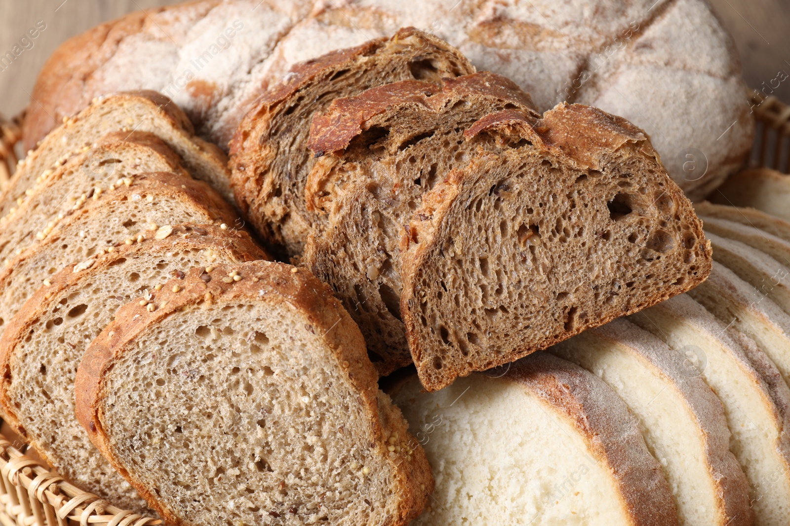 Photo of Different types of fresh bread, closeup view