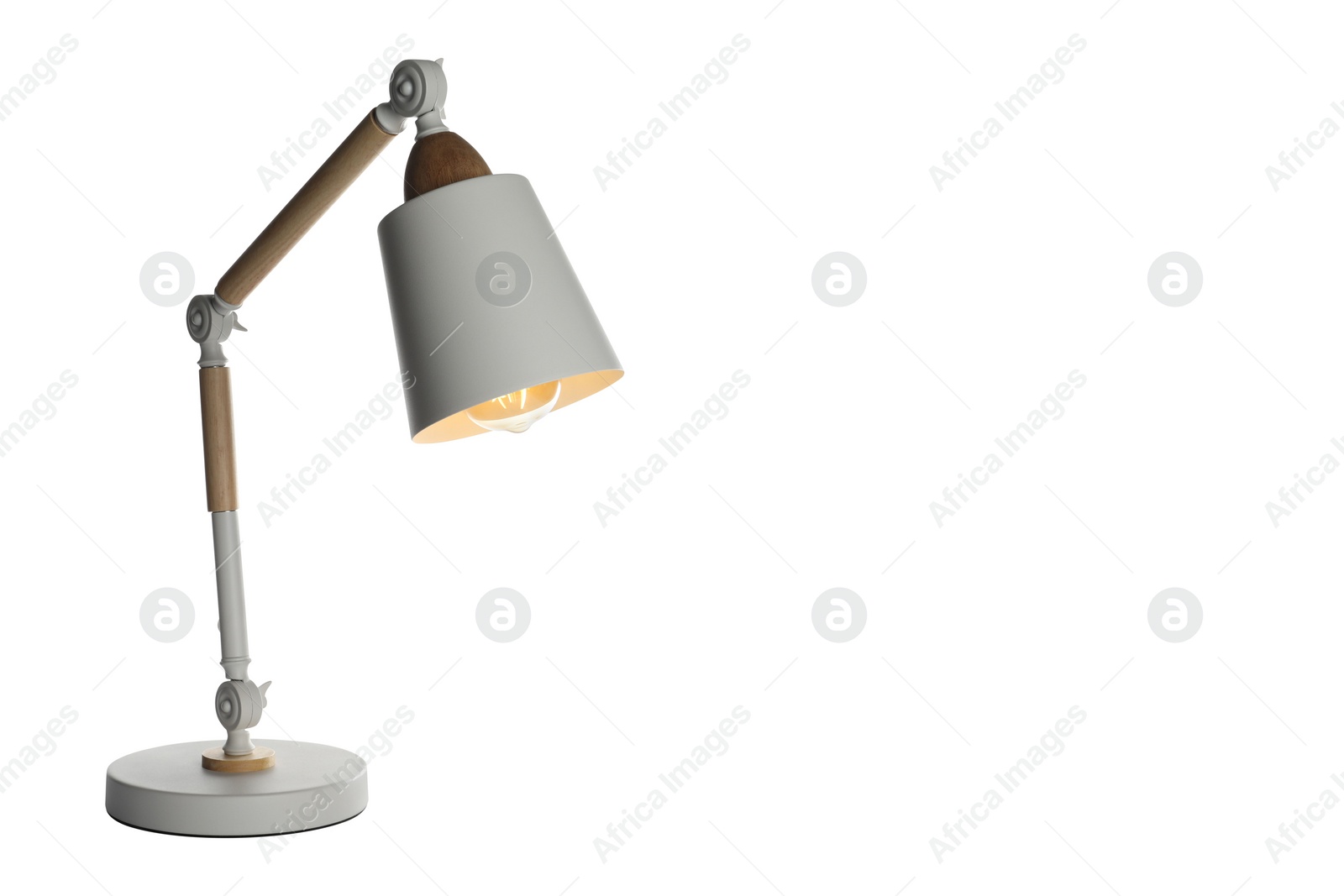 Photo of Stylish modern desk lamp isolated on white