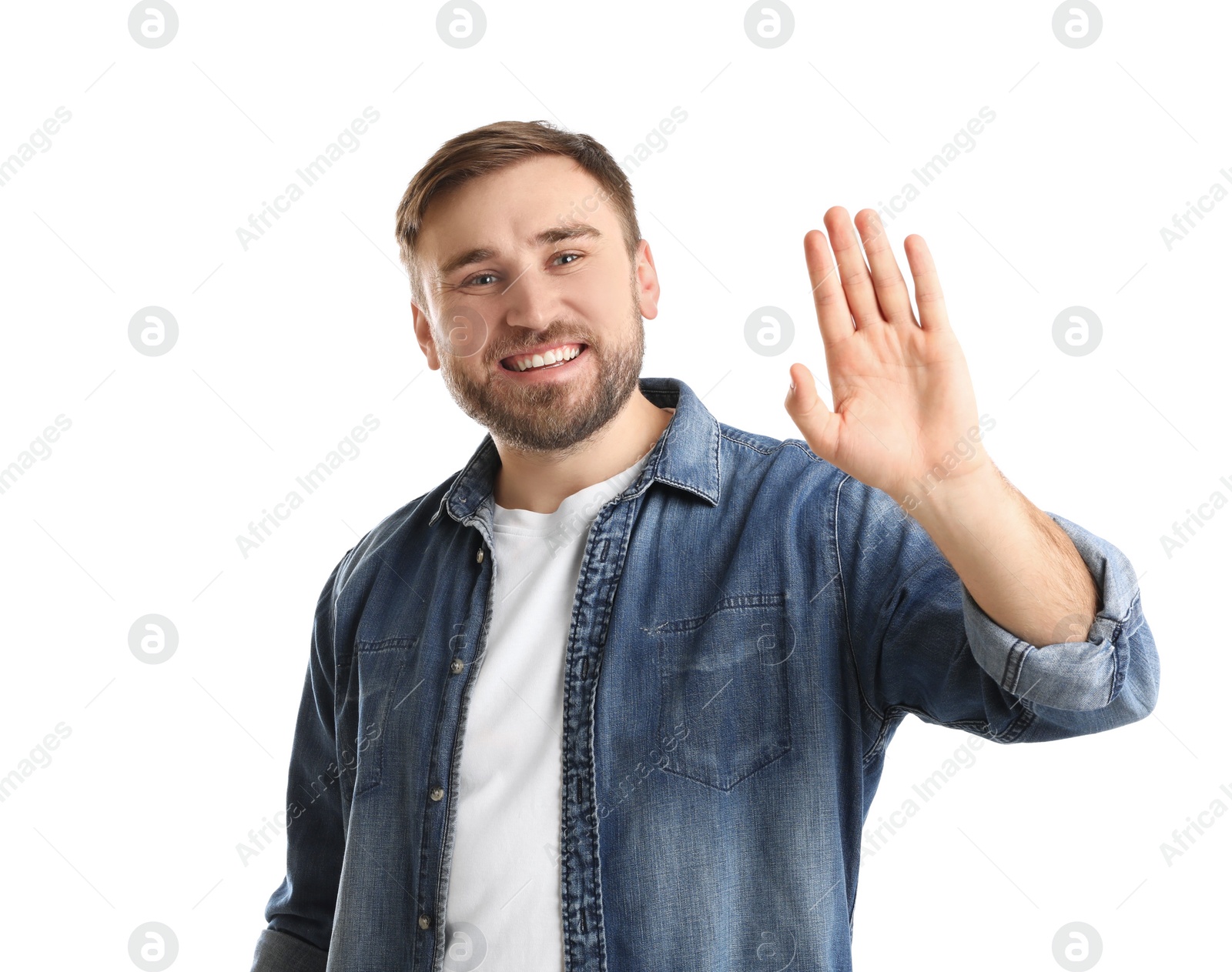 Photo of Happy young man waving to say hello on white background