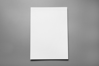 Photo of Blank paper sheets for brochure on grey background, top view. Mock up