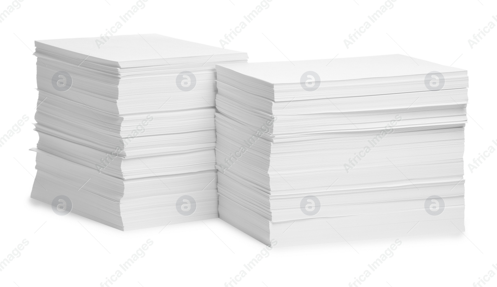 Photo of Stacks of paper sheets on white background