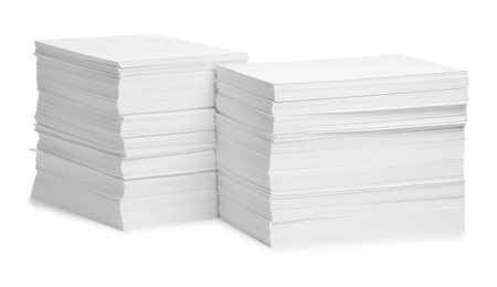 Photo of Stacks of paper sheets on white background