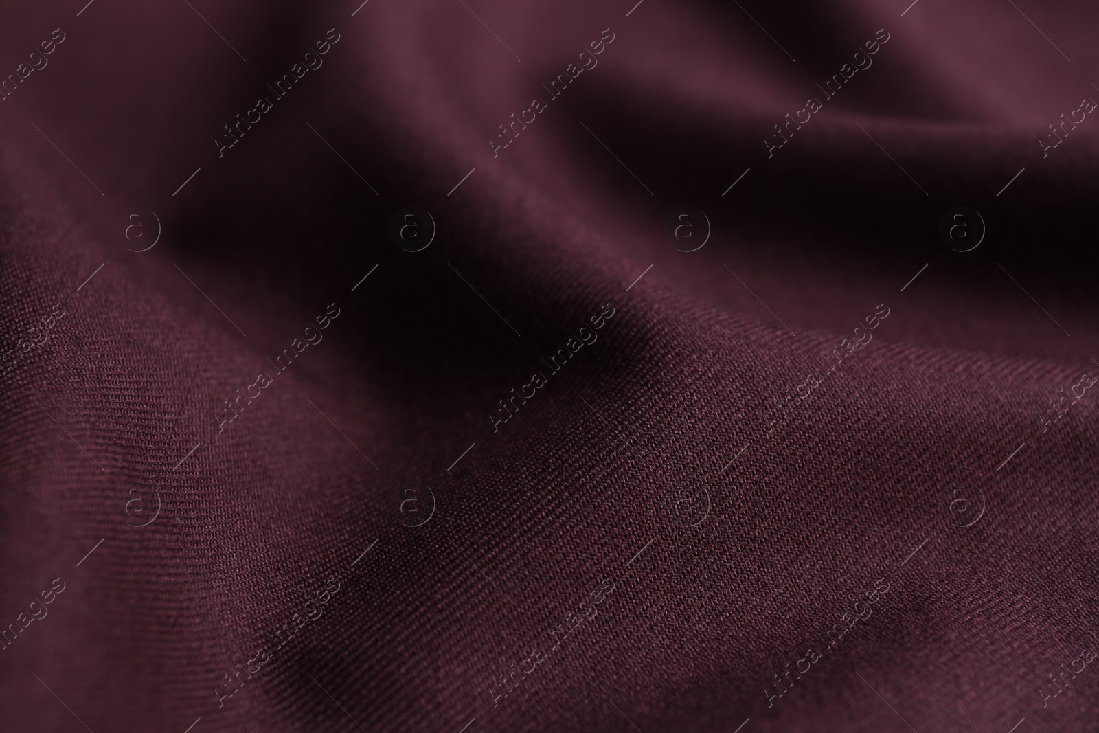 Photo of Texture of beautiful dark red fabric as background, closeup