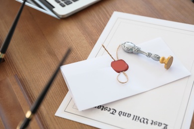 Photo of Vintage notary stamp and documents on desk, closeup