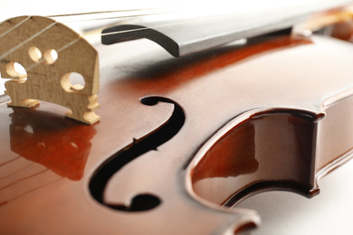 Photo of Beautiful classic violin, closeup view. Musical instrument