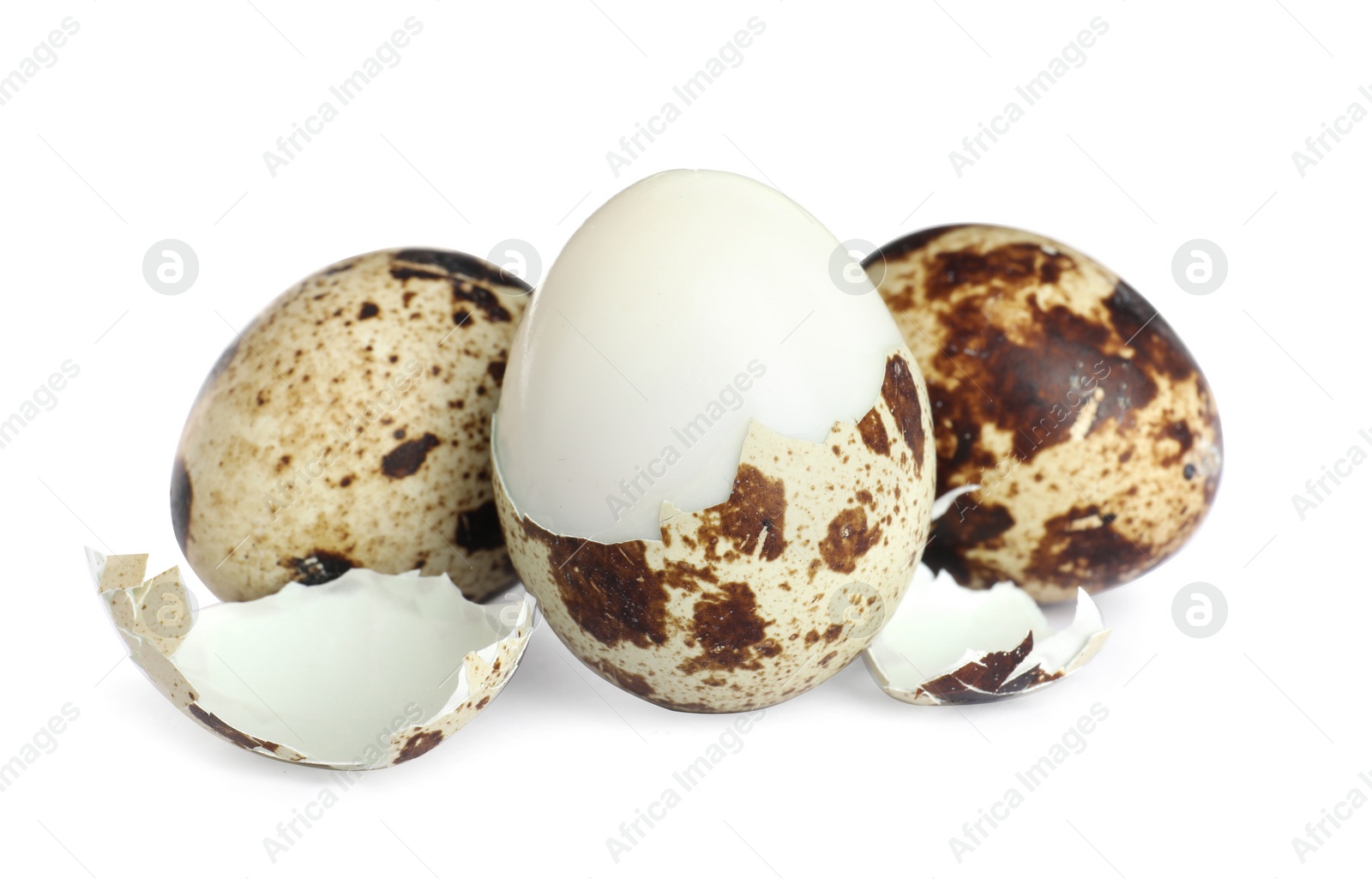 Photo of Boiled quail eggs and pieces of shell isolated on white