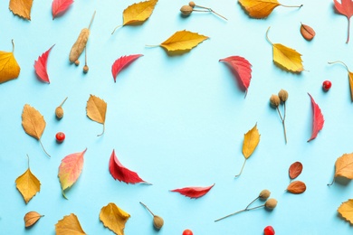 Photo of Flat lay composition with autumn leaves and space for text on color background