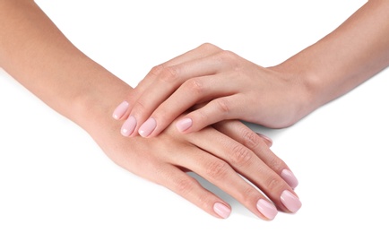 Photo of Woman with beautiful hands on white background, closeup. Spa treatment