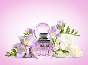 Image of Bottle of luxury perfume and beautiful flowers on lilac background