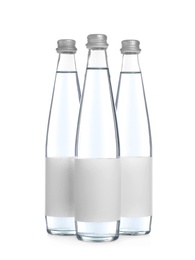 Glass bottles with soda water on white background