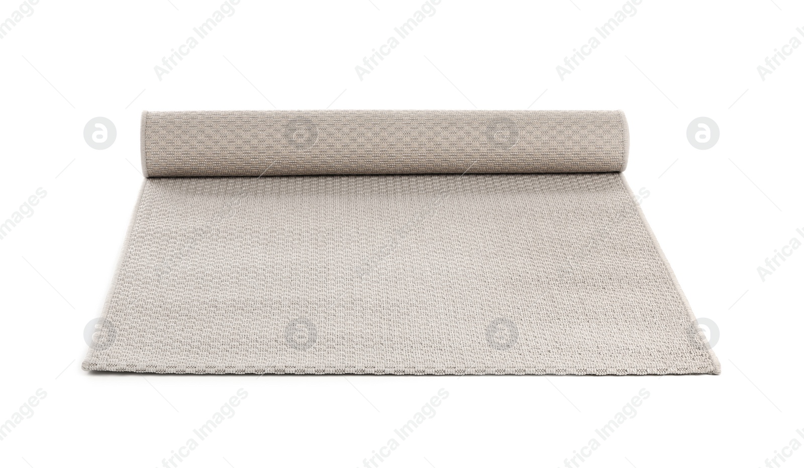 Photo of Rolled grey carpet on white background. Interior element