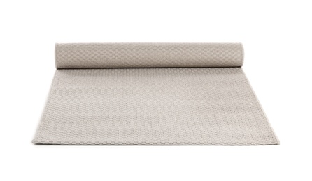 Photo of Rolled grey carpet on white background. Interior element