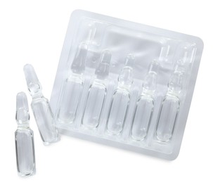 Glass ampoules with pharmaceutical product on white background, top view