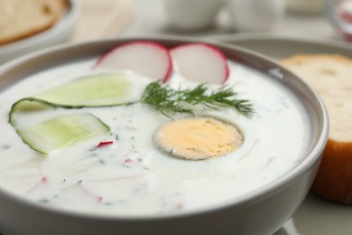 Photo of Delicious cold summer soup in bowl, closeup
