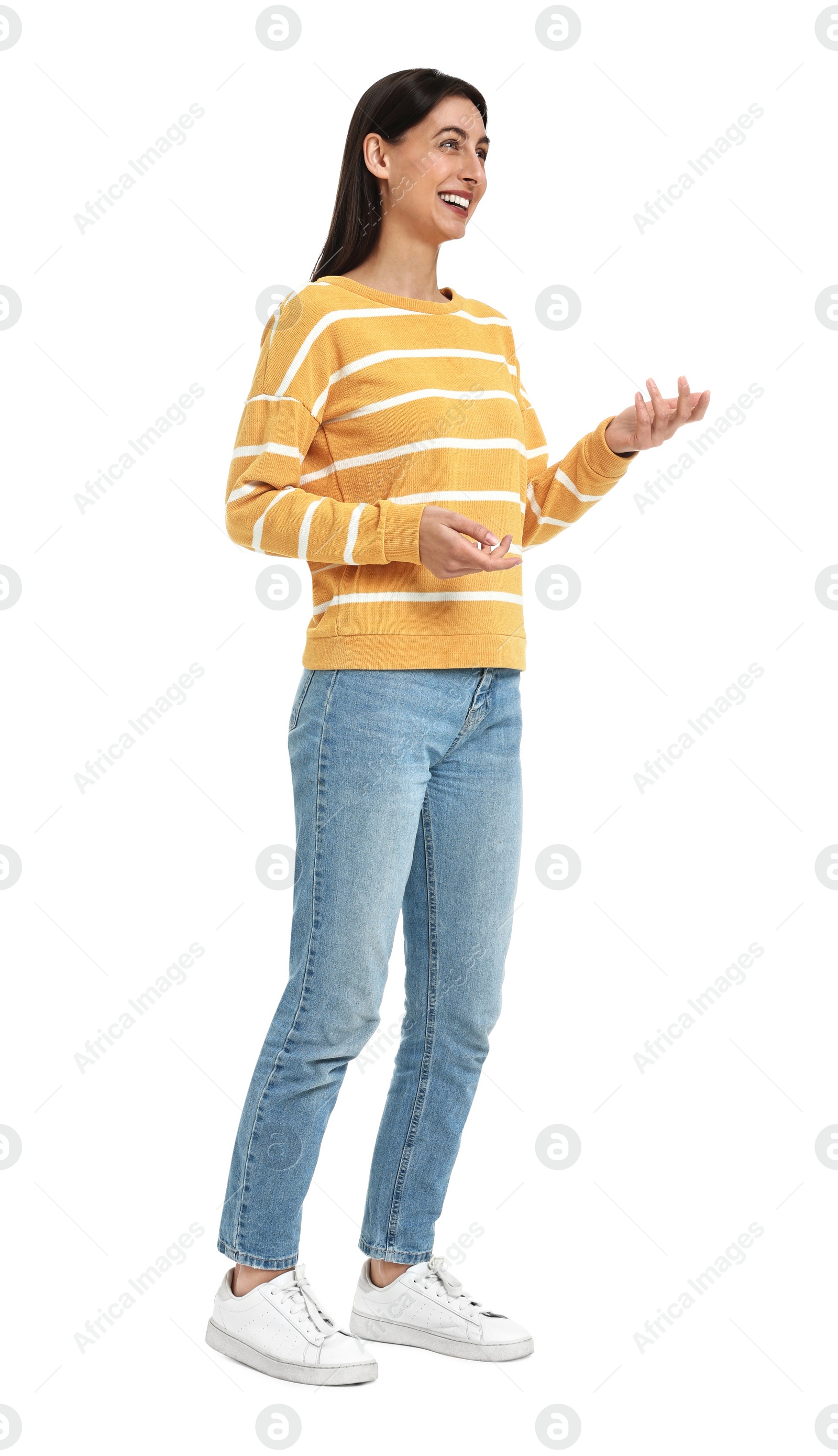 Photo of Happy woman in jeans and sweater on white background