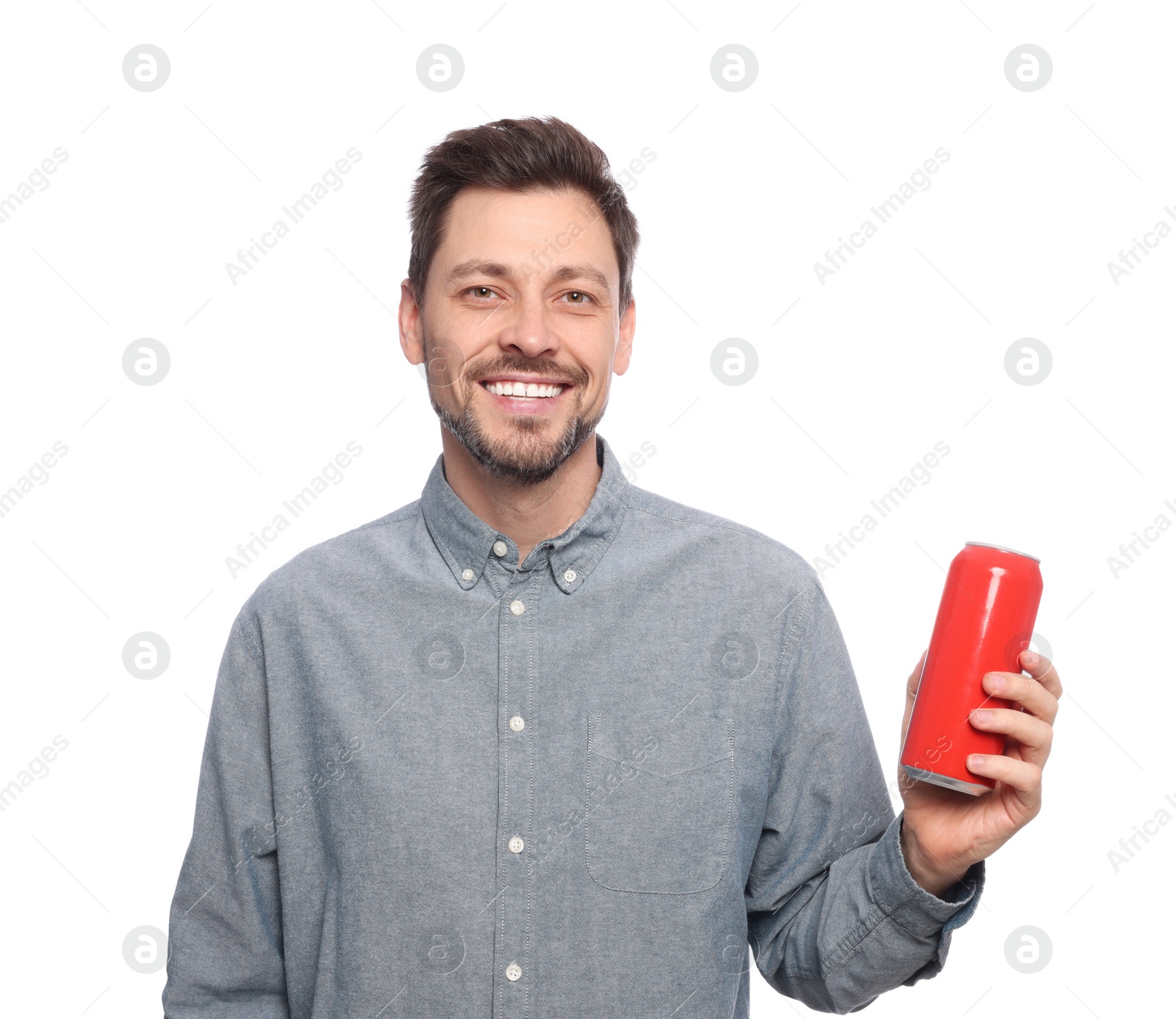 Photo of Happy man holding red tin can with beverage on white background