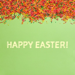 Image of Text Happy Easter and colorful sprinkles on green background, flat lay. Confectionery decor