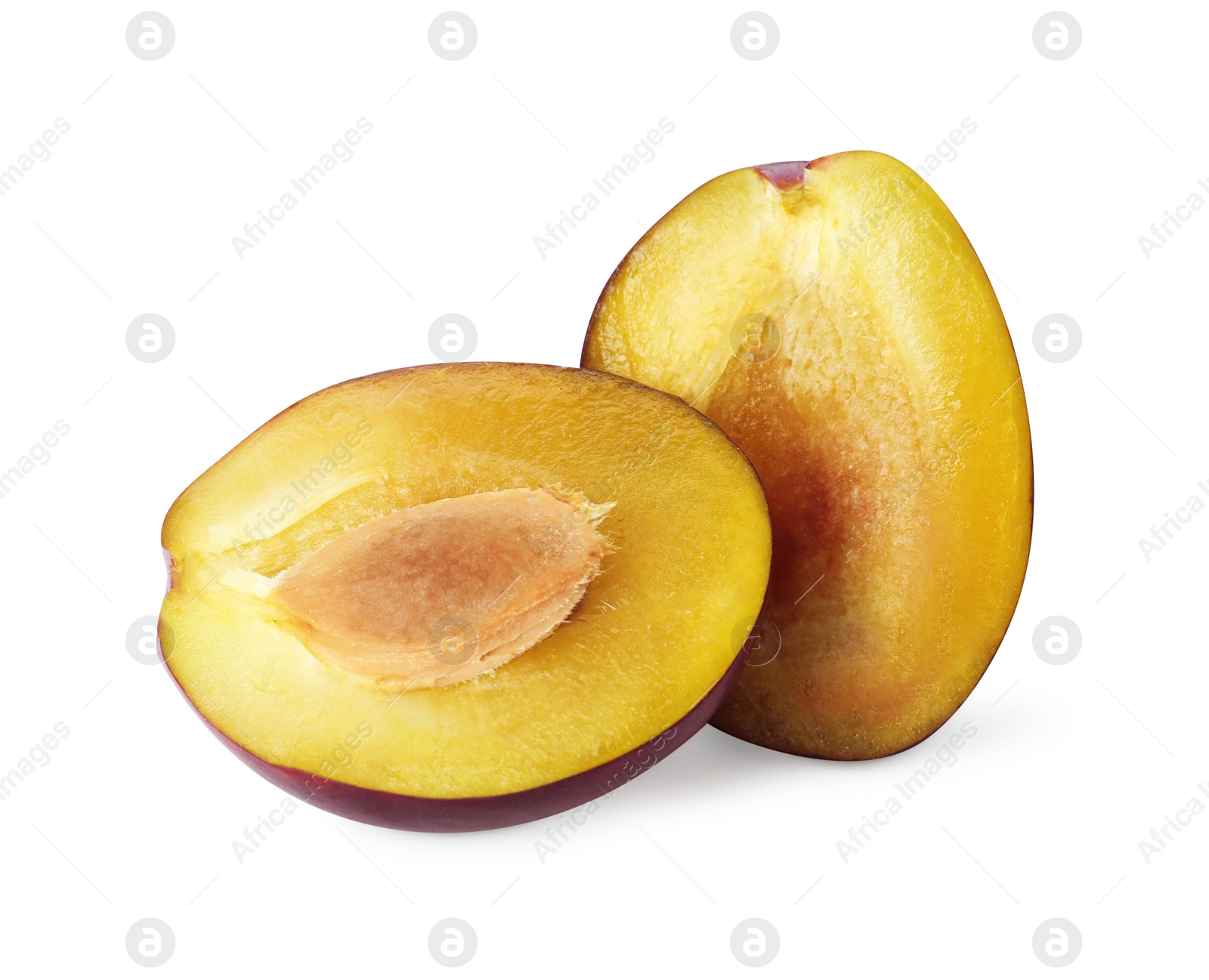 Photo of Halves of fresh ripe plum on white background