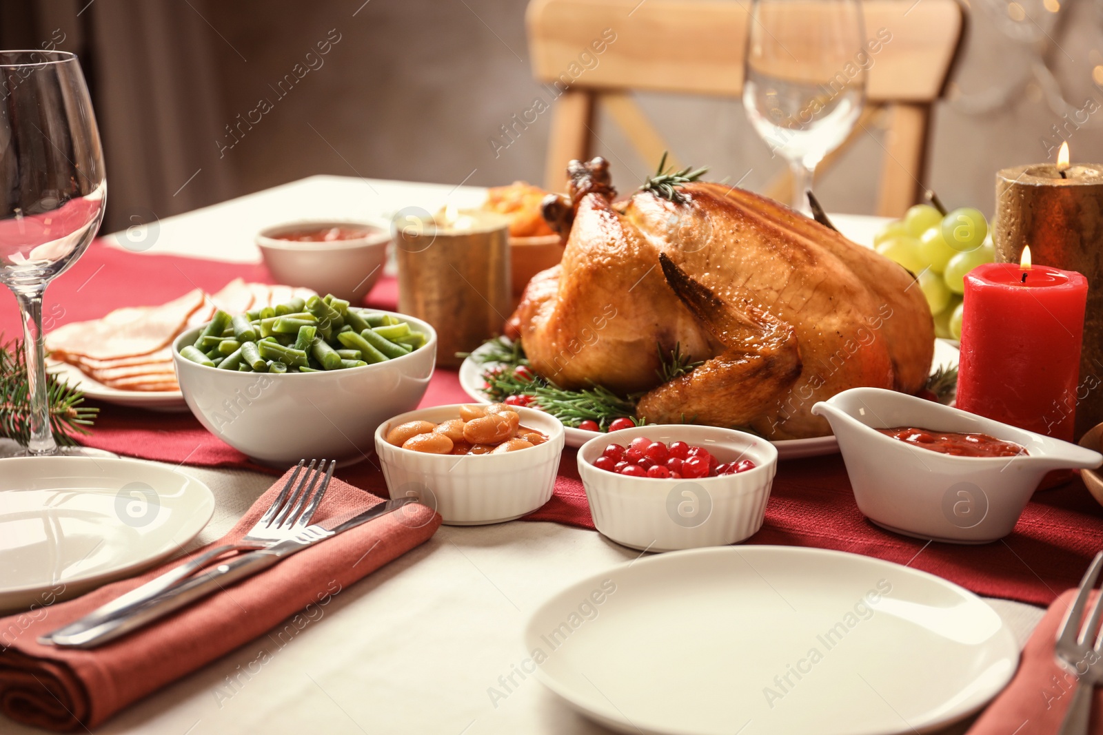 Photo of Traditional festive dinner with delicious roasted turkey served on table