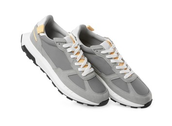 Photo of Pair of stylish grey sneakers isolated on white