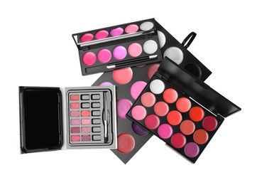Photo of Cream lipstick palettes on white background, top view. Professional cosmetic product