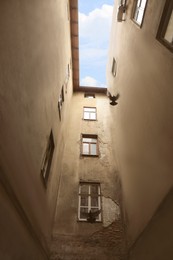 Beautiful old building against blue sky, low angle view