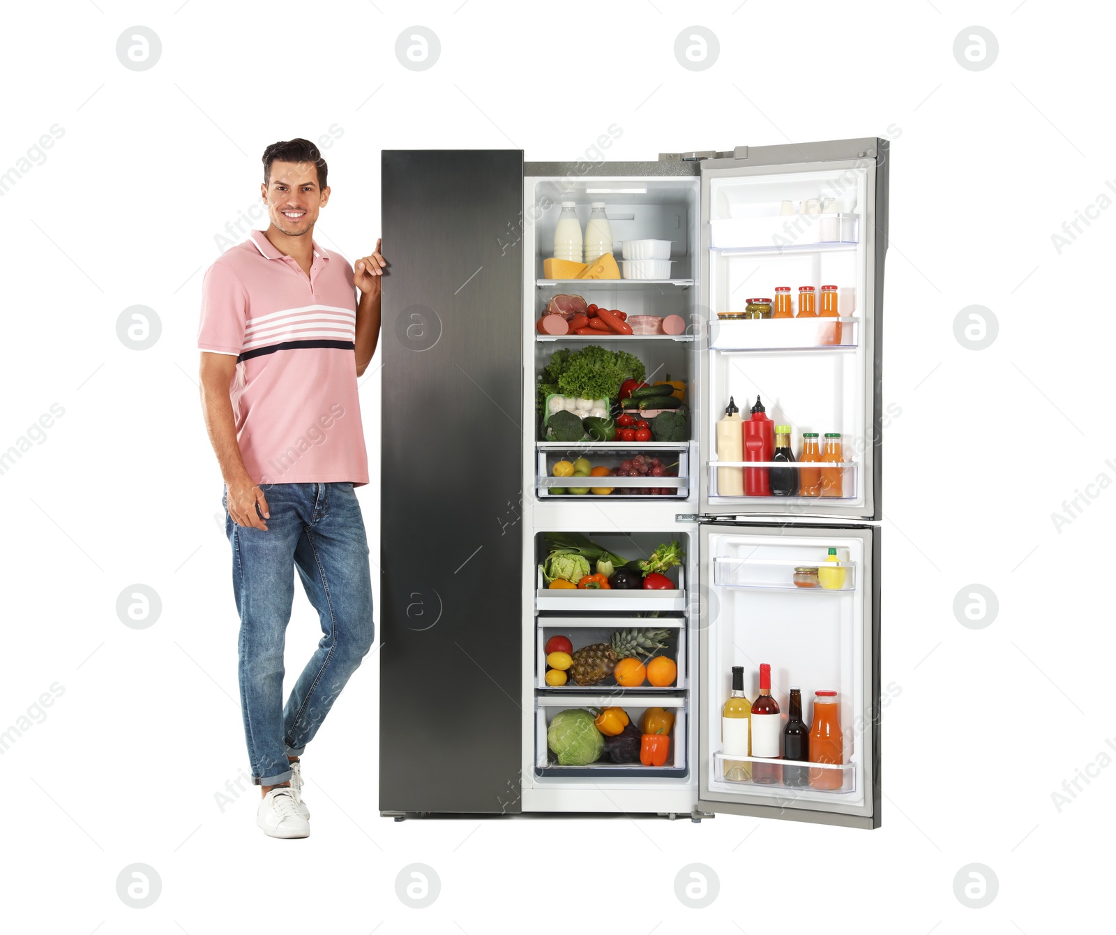 Photo of Man near open refrigerator on white background