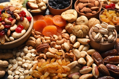 Photo of Composition of different dried fruits and nuts, closeup